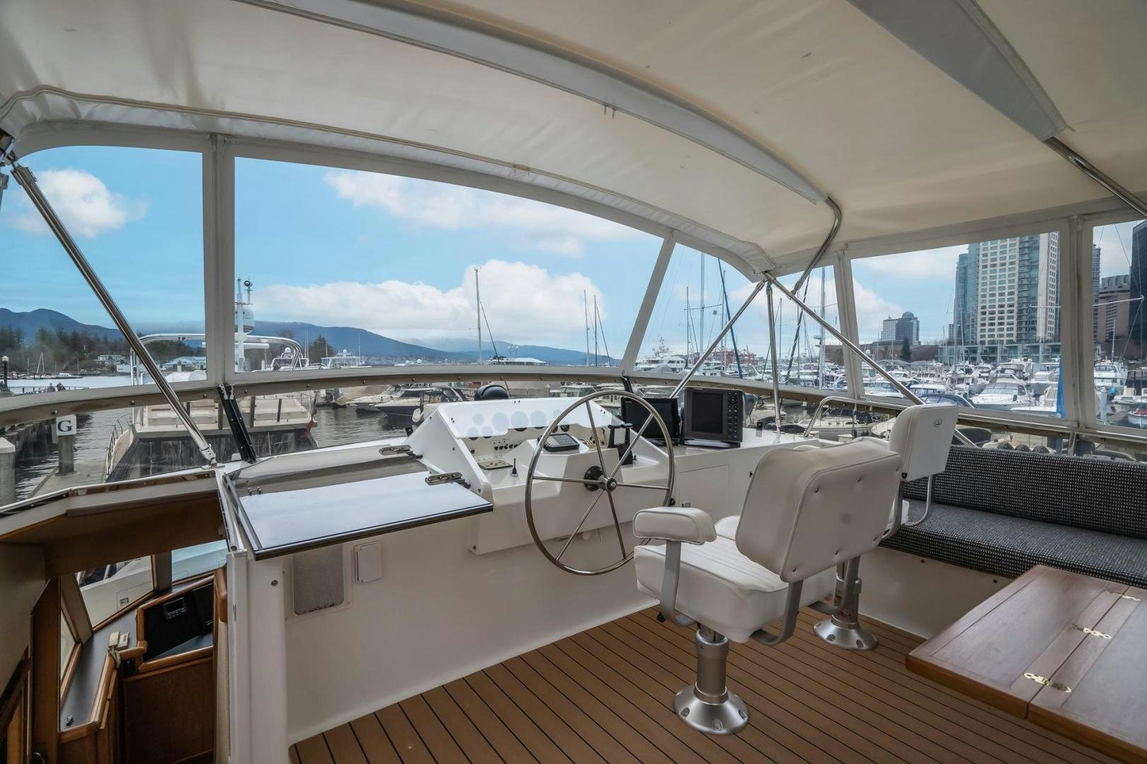 a room with a view of the water and a city aboard PARAGON Yacht for Sale