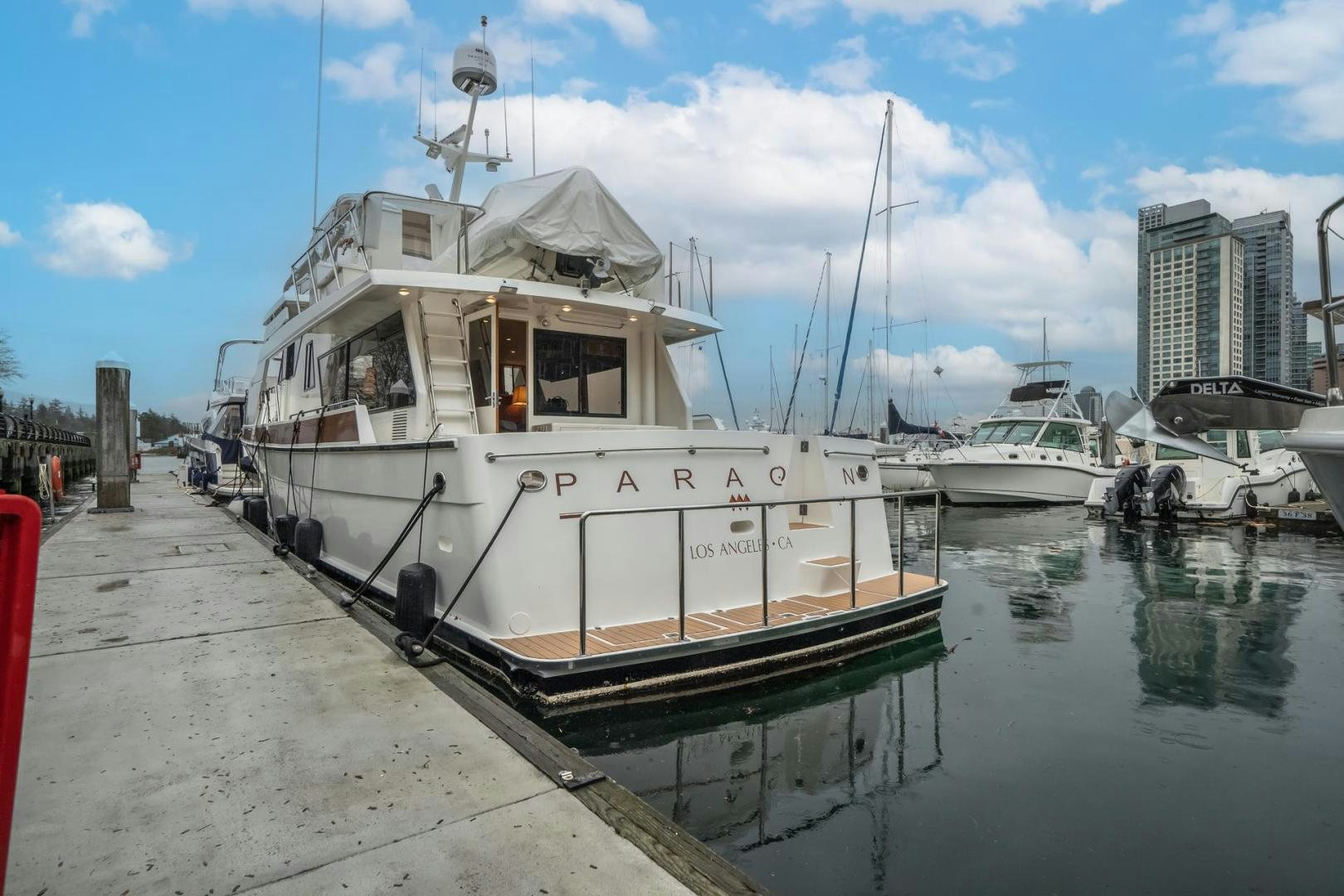 a boat docked at a pier aboard PARAGON Yacht for Sale