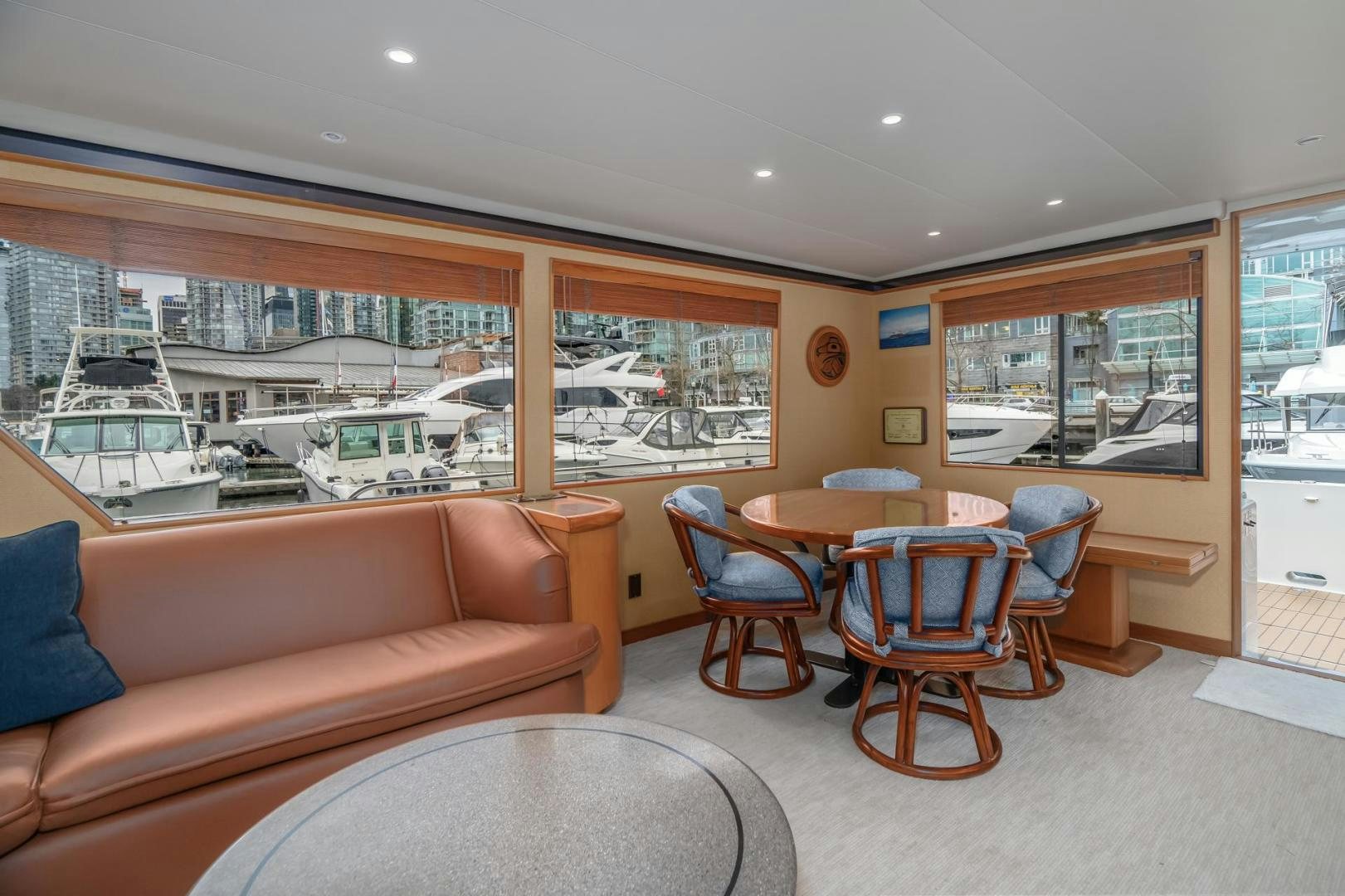 a living room with a couch and a table aboard PARAGON Yacht for Sale