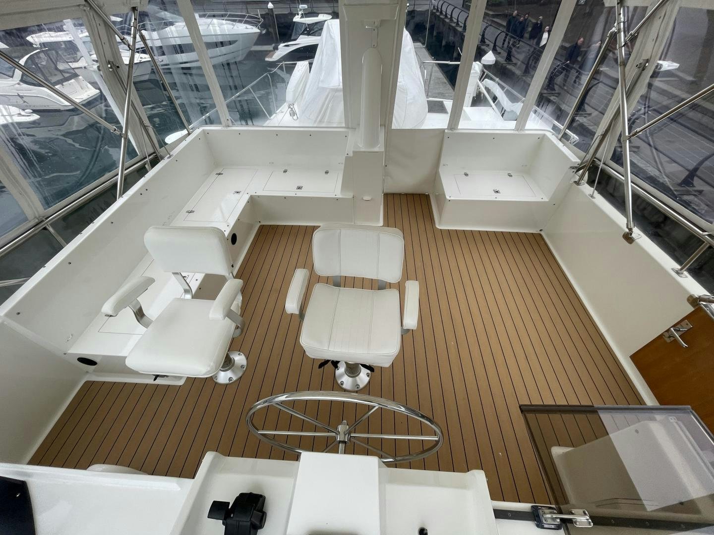 a room with a large group of white chairs and a dog on a leash aboard PARAGON Yacht for Sale