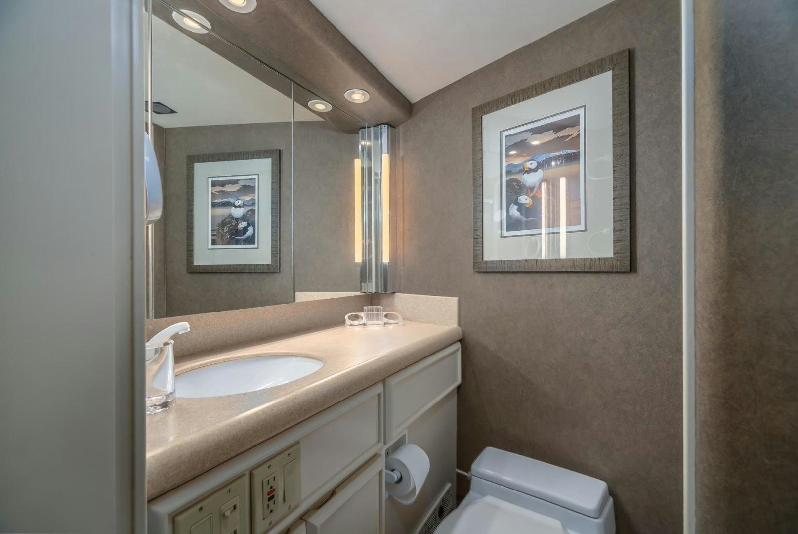 a bathroom with a mirror and a sink aboard PARAGON Yacht for Sale
