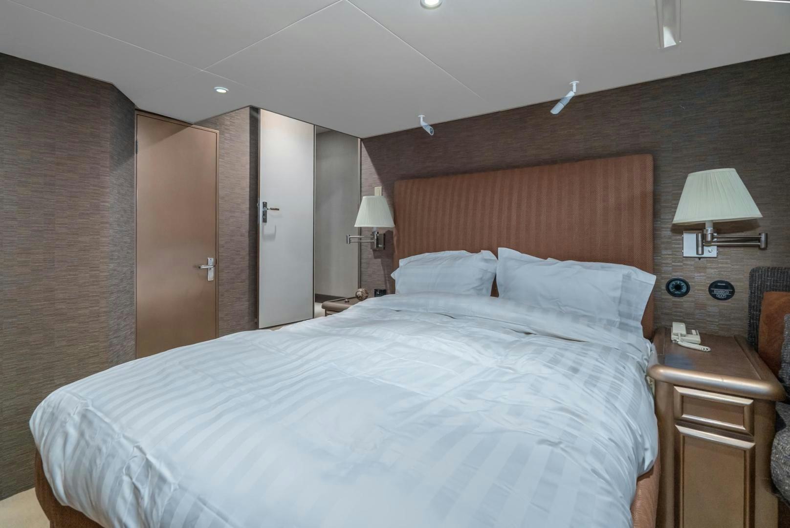 a bed in a hotel room aboard PARAGON Yacht for Sale