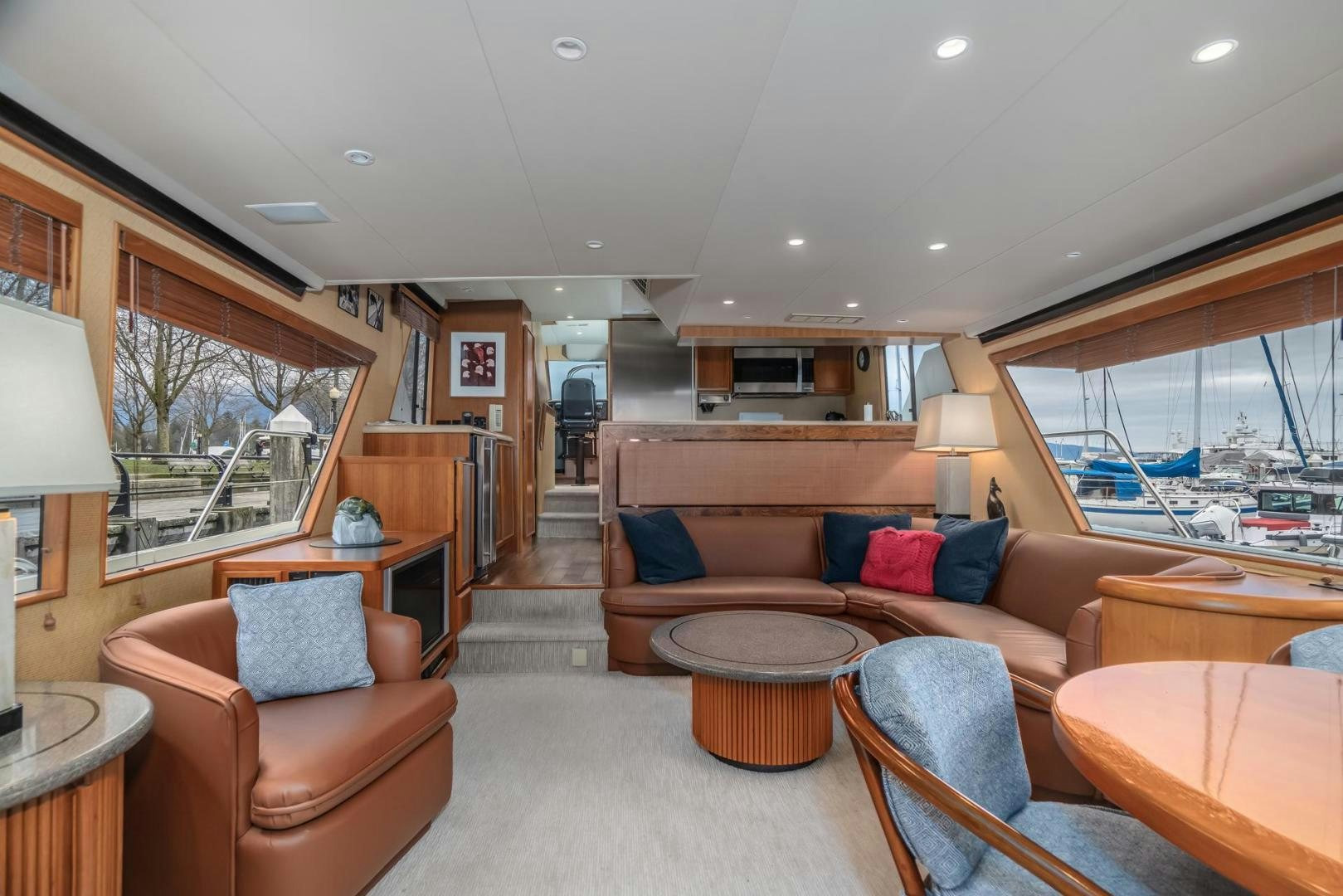a living room with a large window aboard PARAGON Yacht for Sale