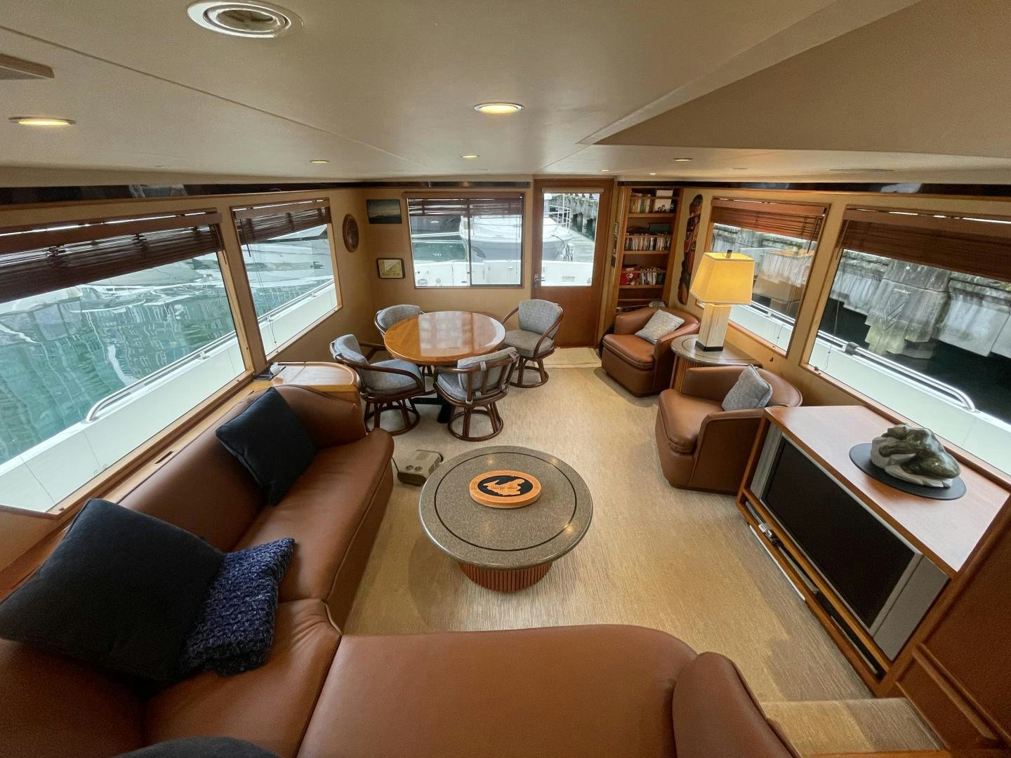 a living room with a large window aboard PARAGON Yacht for Sale