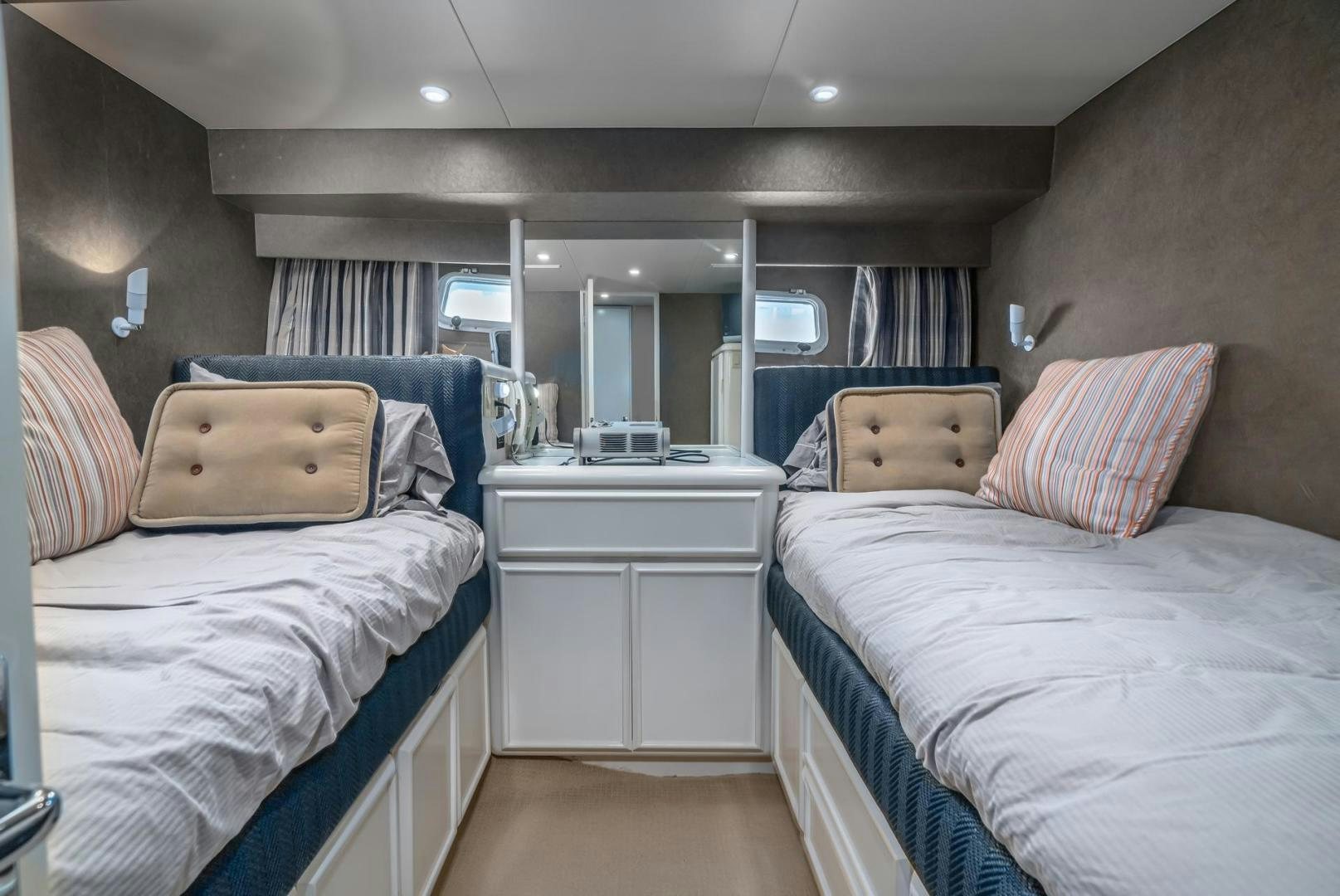 a couple of beds in a room aboard PARAGON Yacht for Sale
