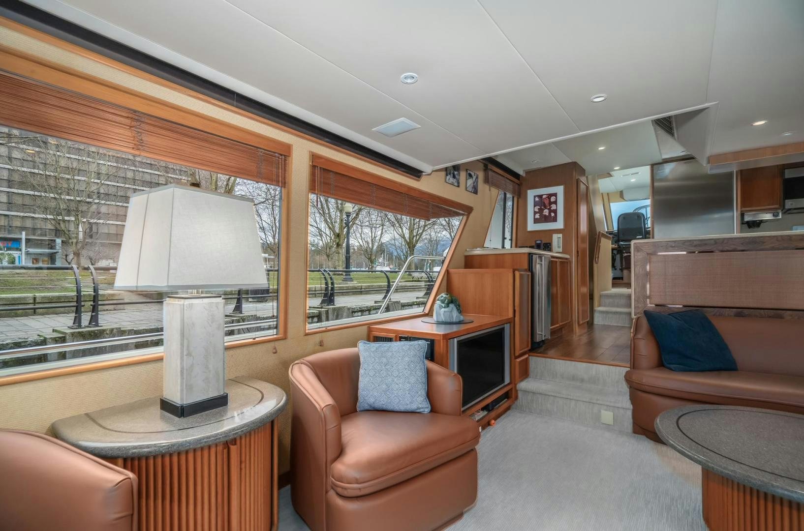 a living room with a lamp and a table aboard PARAGON Yacht for Sale