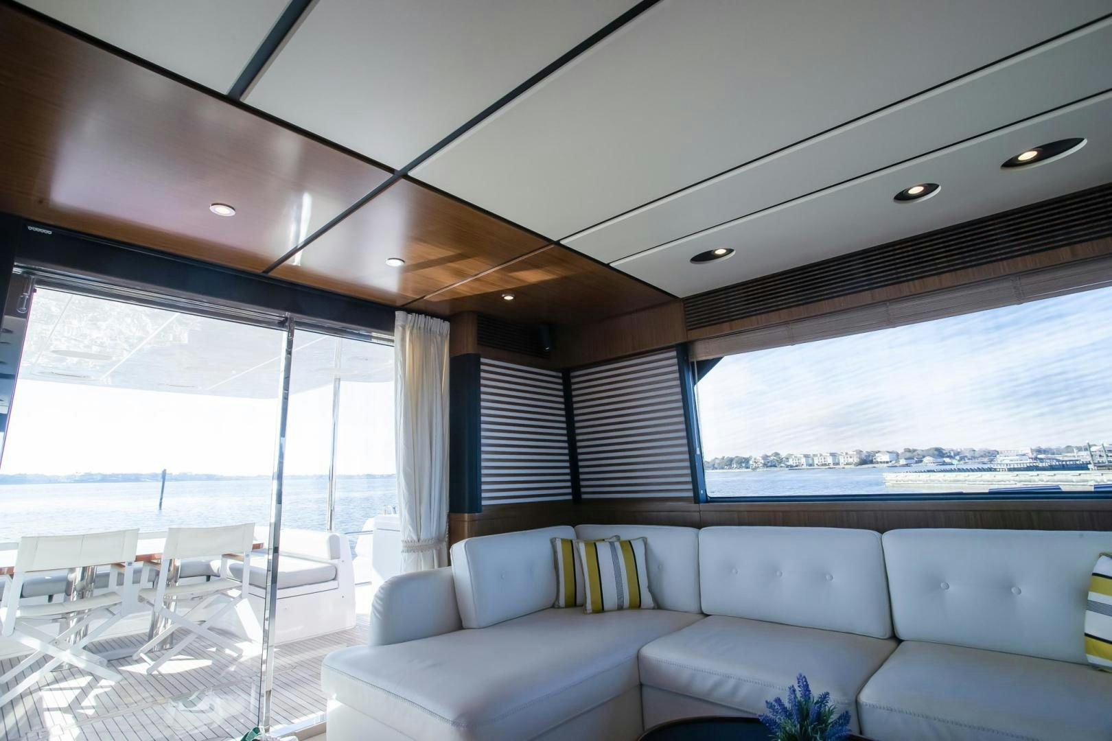 a living room with a large window aboard ROY Yacht for Sale
