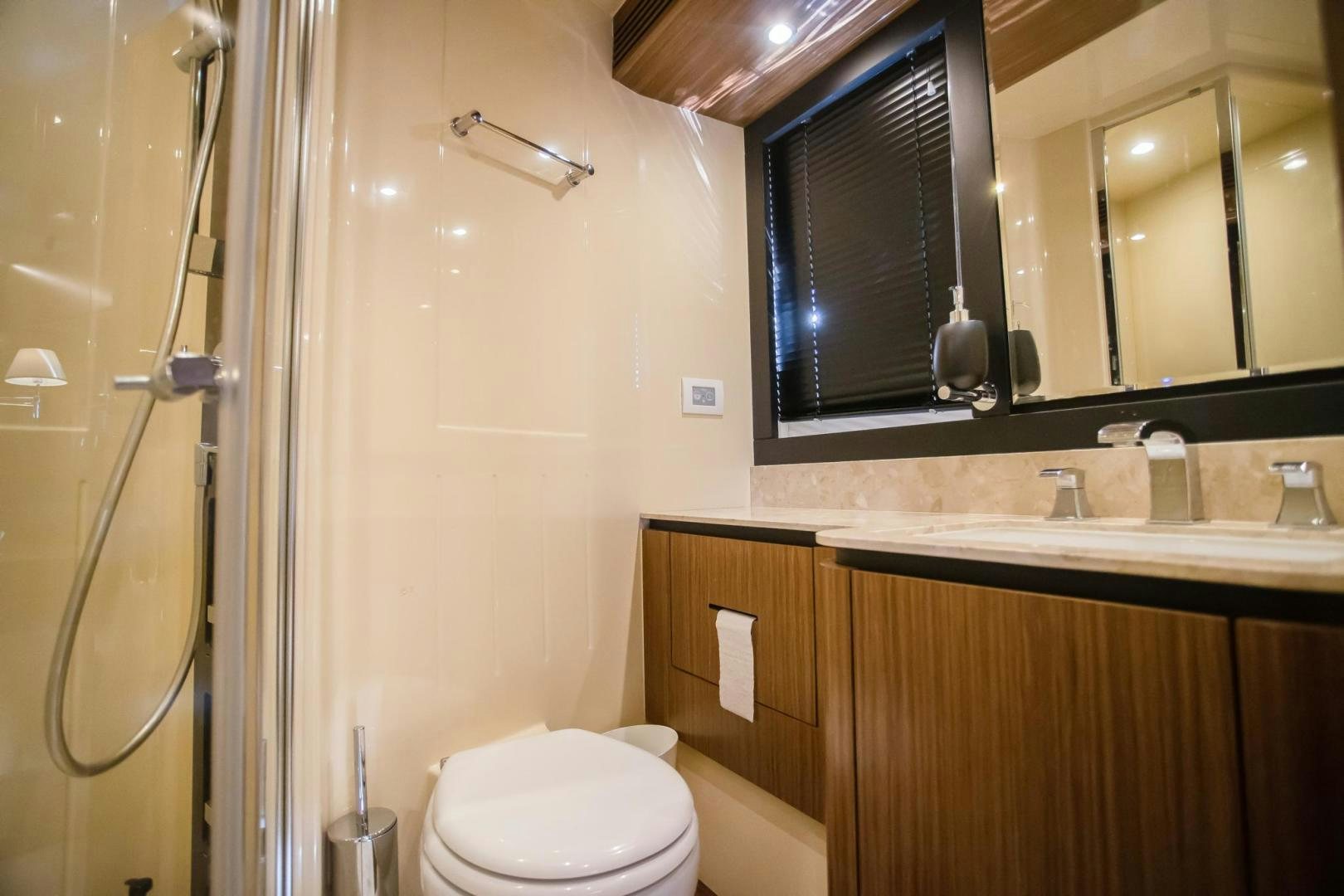 a bathroom with a toilet and a sink aboard ROY Yacht for Sale
