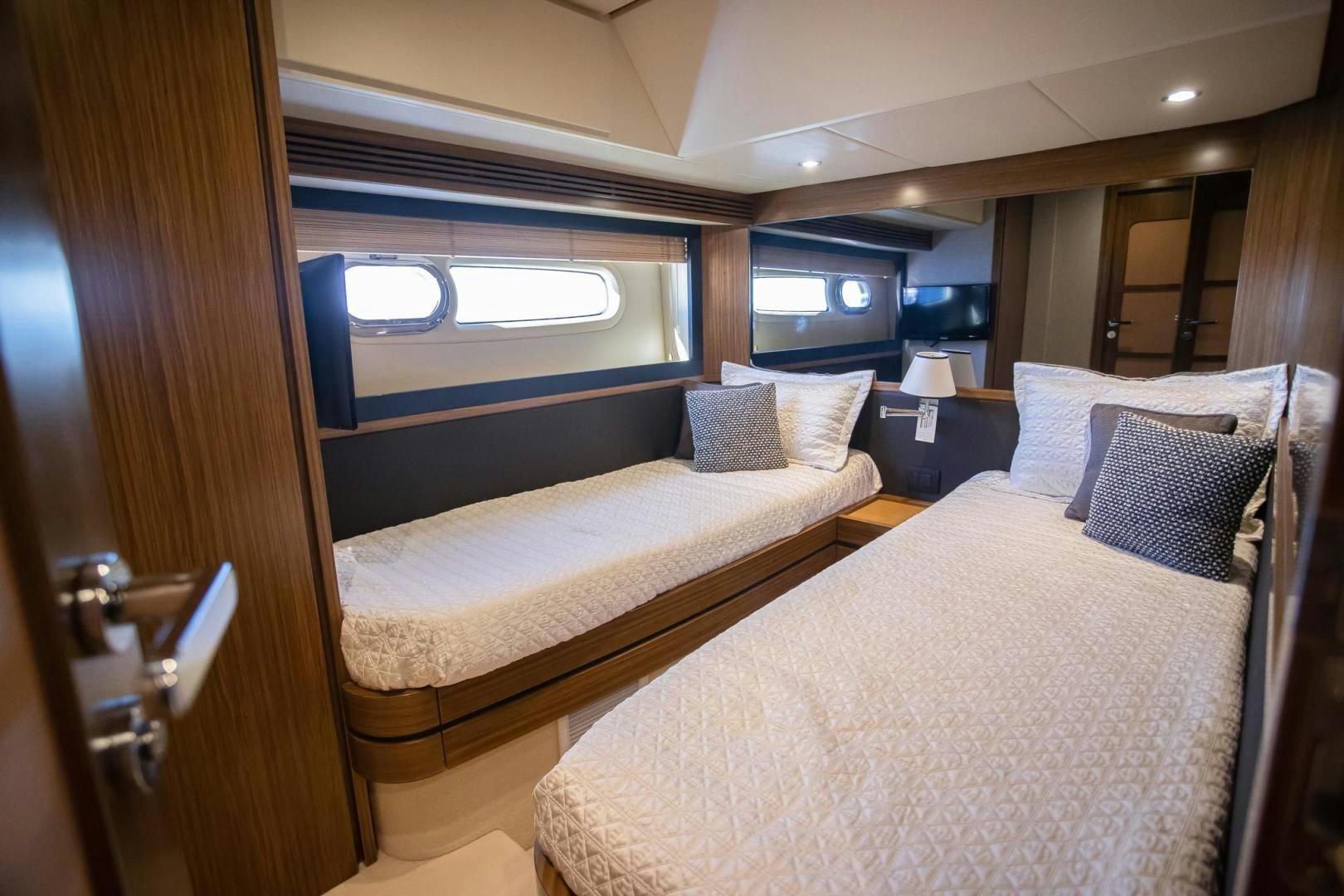 a room with two beds aboard ROY Yacht for Sale