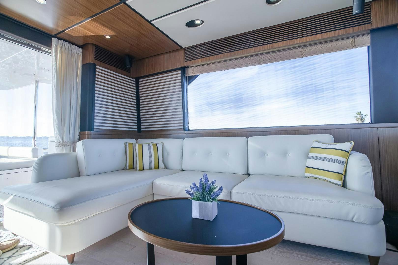 a white couch with a coffee table aboard ROY Yacht for Sale