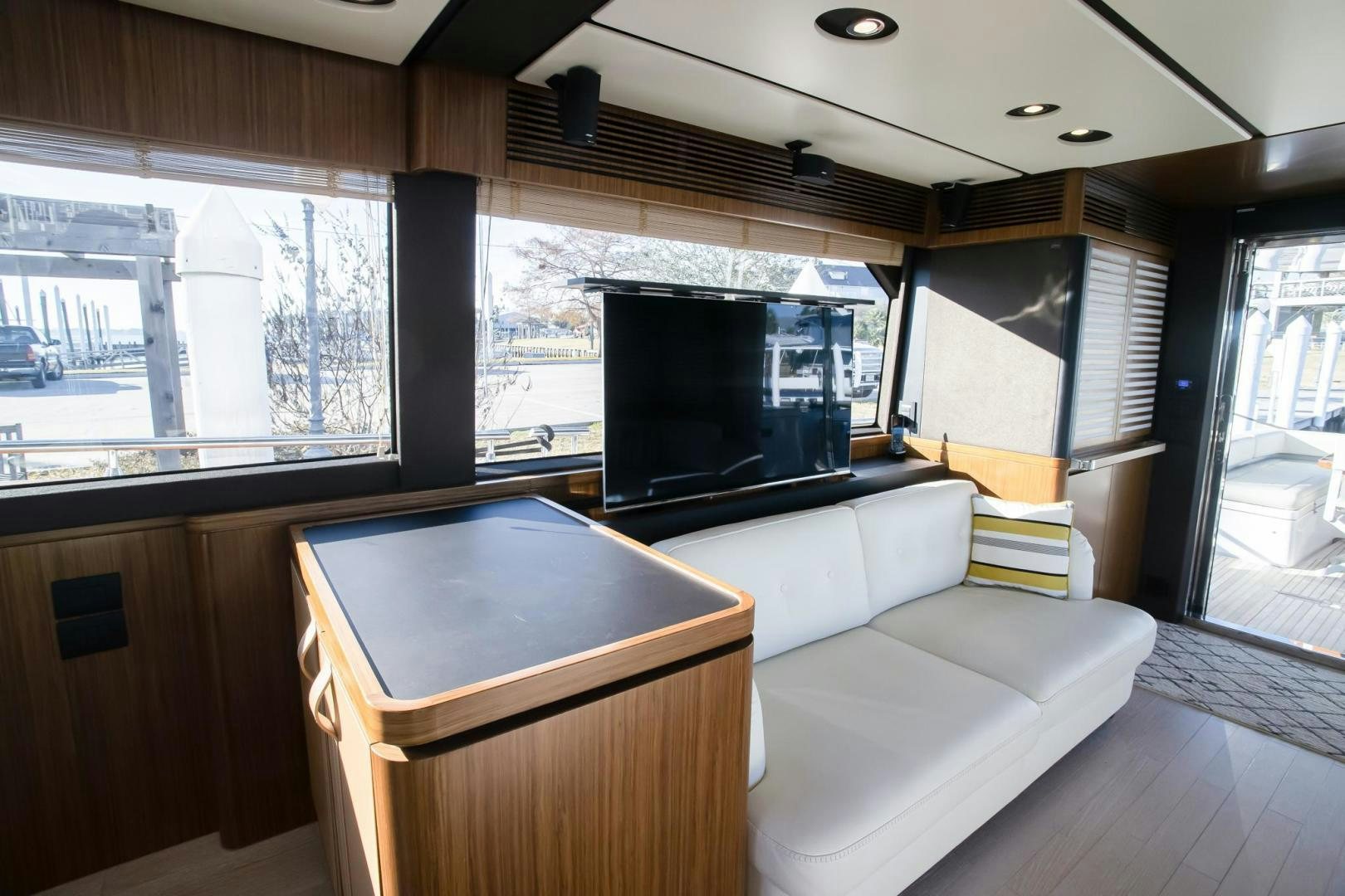a living room with a large tv aboard ROY Yacht for Sale