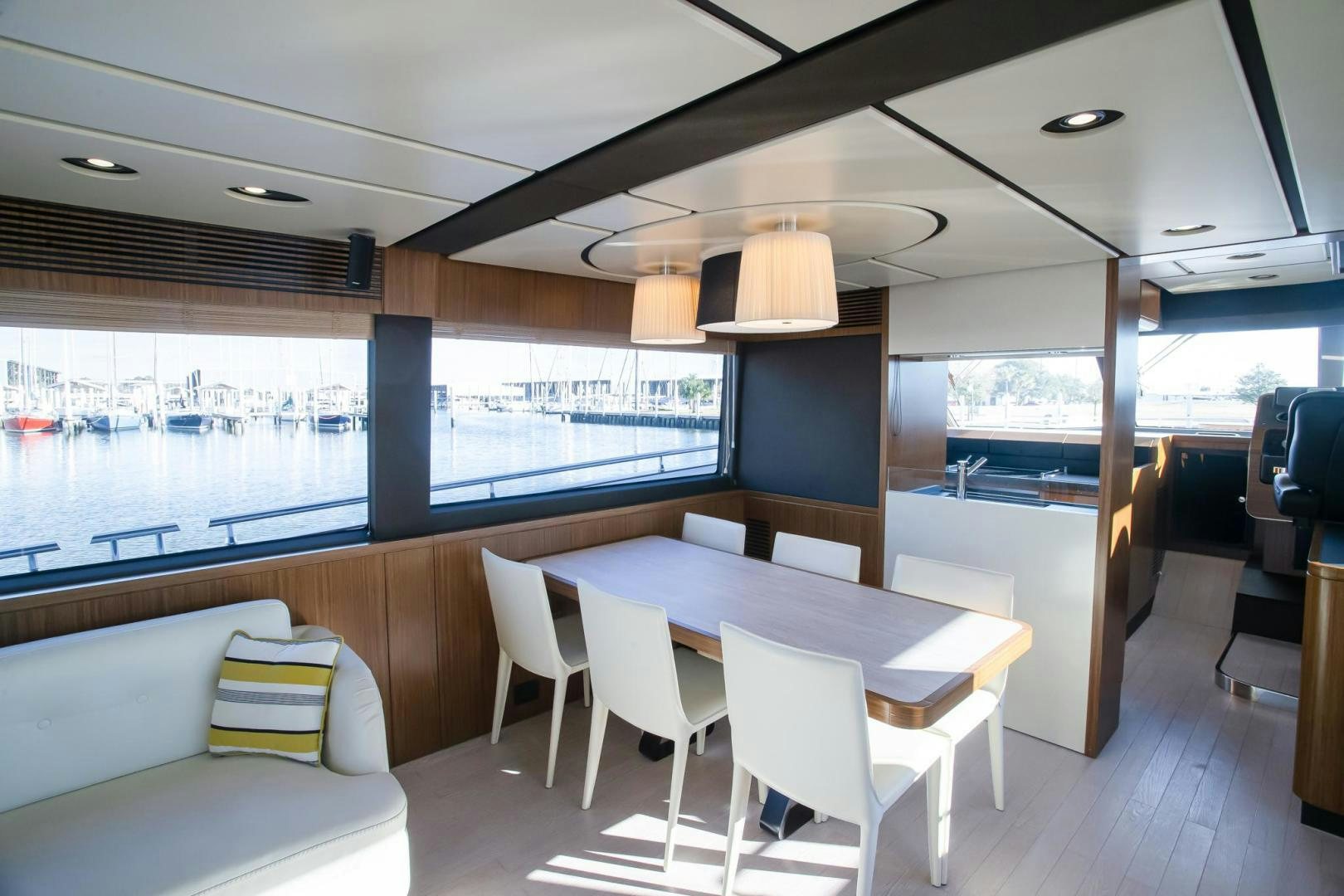 a room with a table and chairs aboard ROY Yacht for Sale
