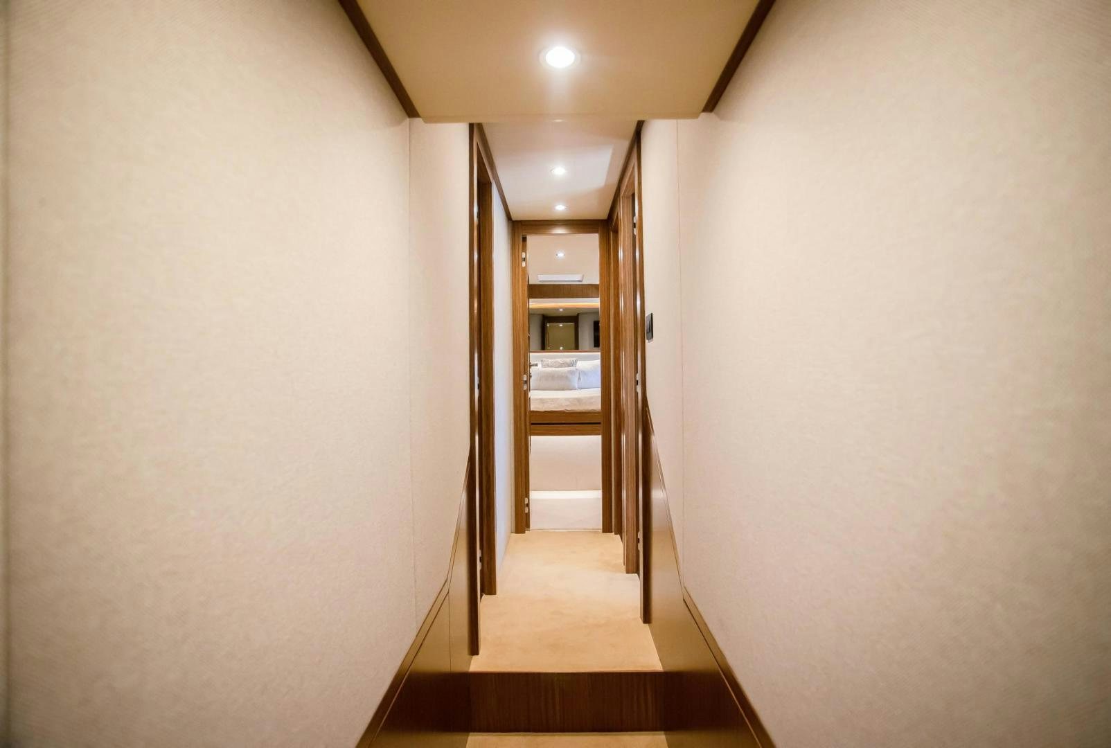 a hallway with a door and a hallway aboard ROY Yacht for Sale
