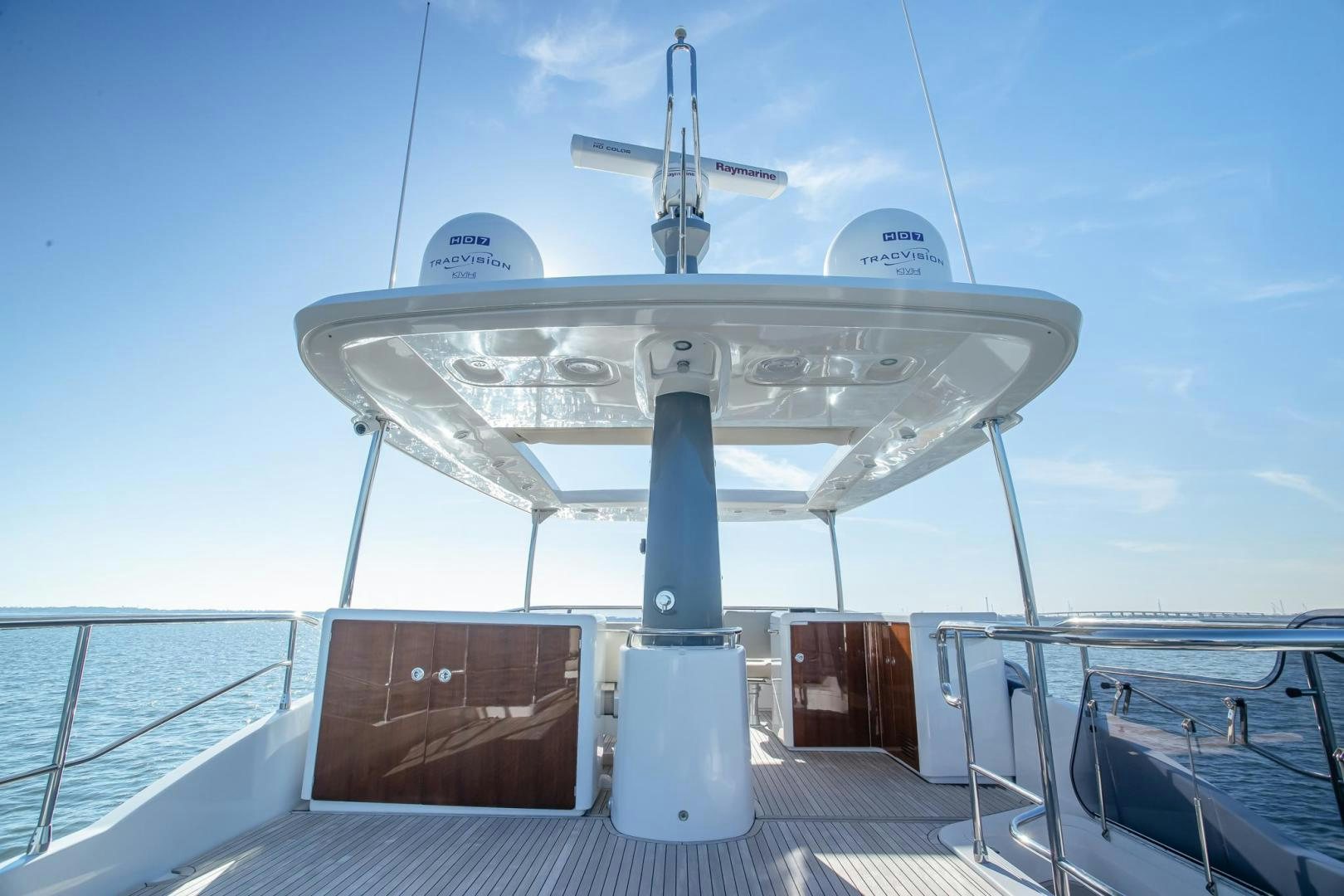 a white boat on a dock aboard ROY Yacht for Sale