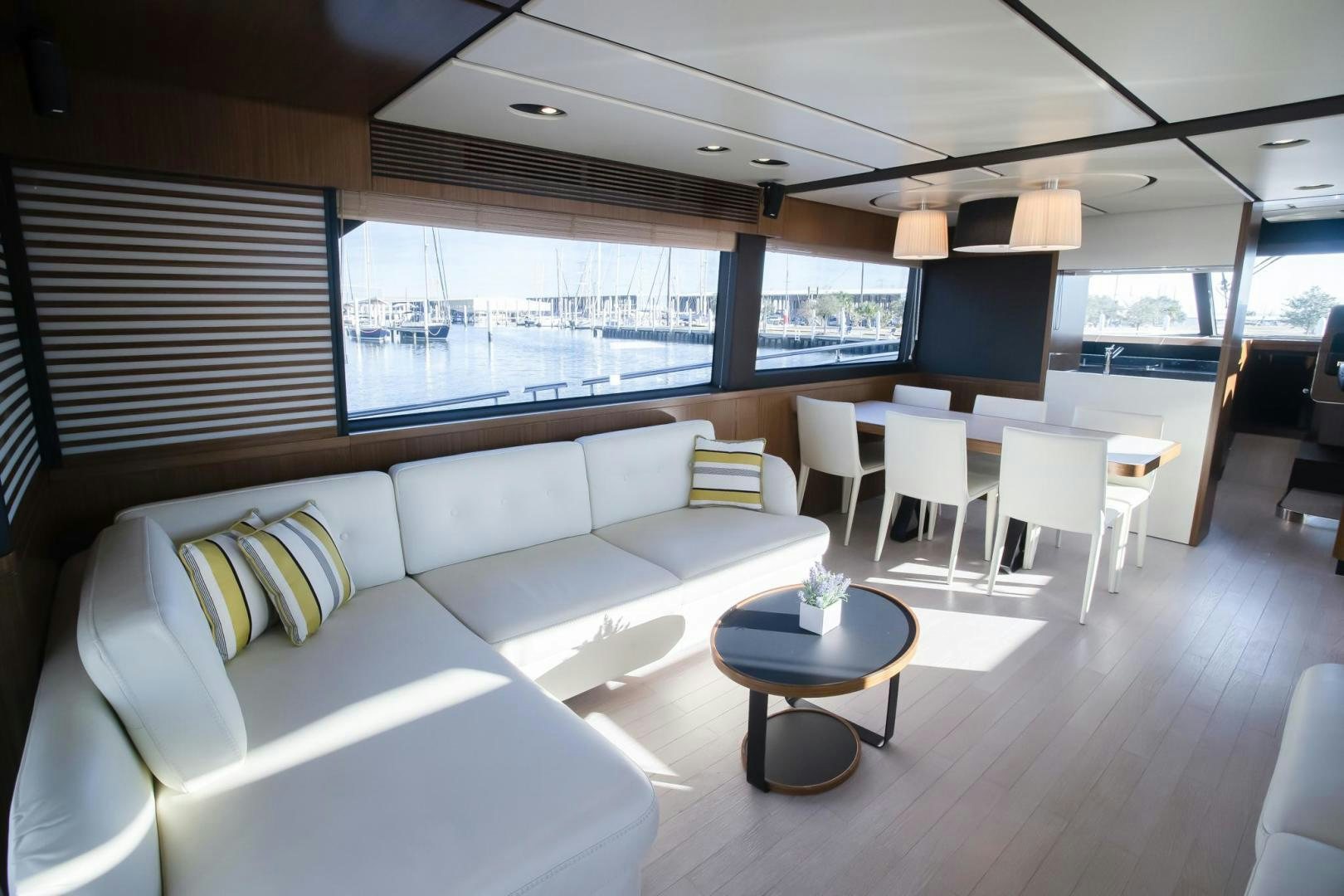 a living room with a couch and a table aboard ROY Yacht for Sale