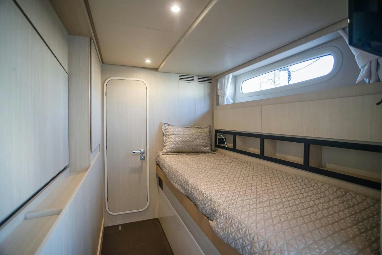 a bed in a room aboard ROY Yacht for Sale