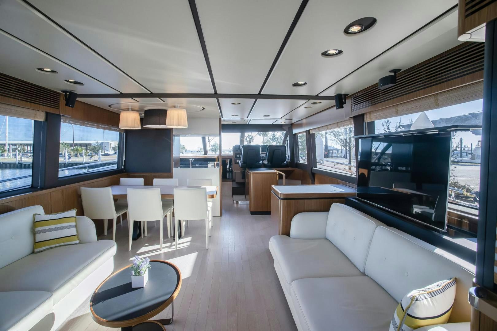 a living room with a large window aboard ROY Yacht for Sale