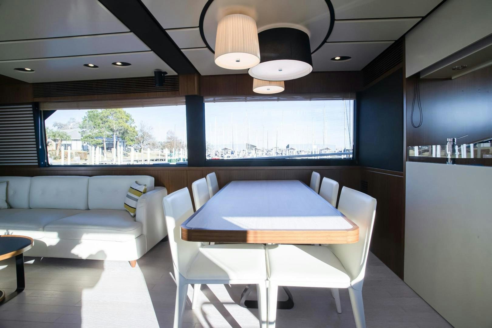 a room with a couch and a table and a lamp aboard ROY Yacht for Sale