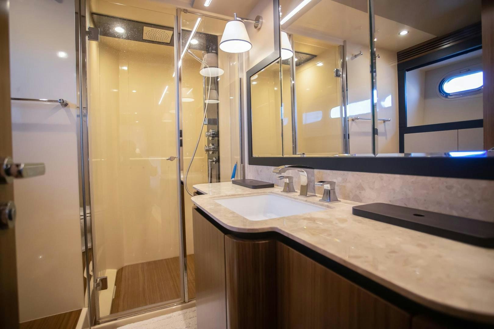a bathroom with a glass shower aboard ROY Yacht for Sale