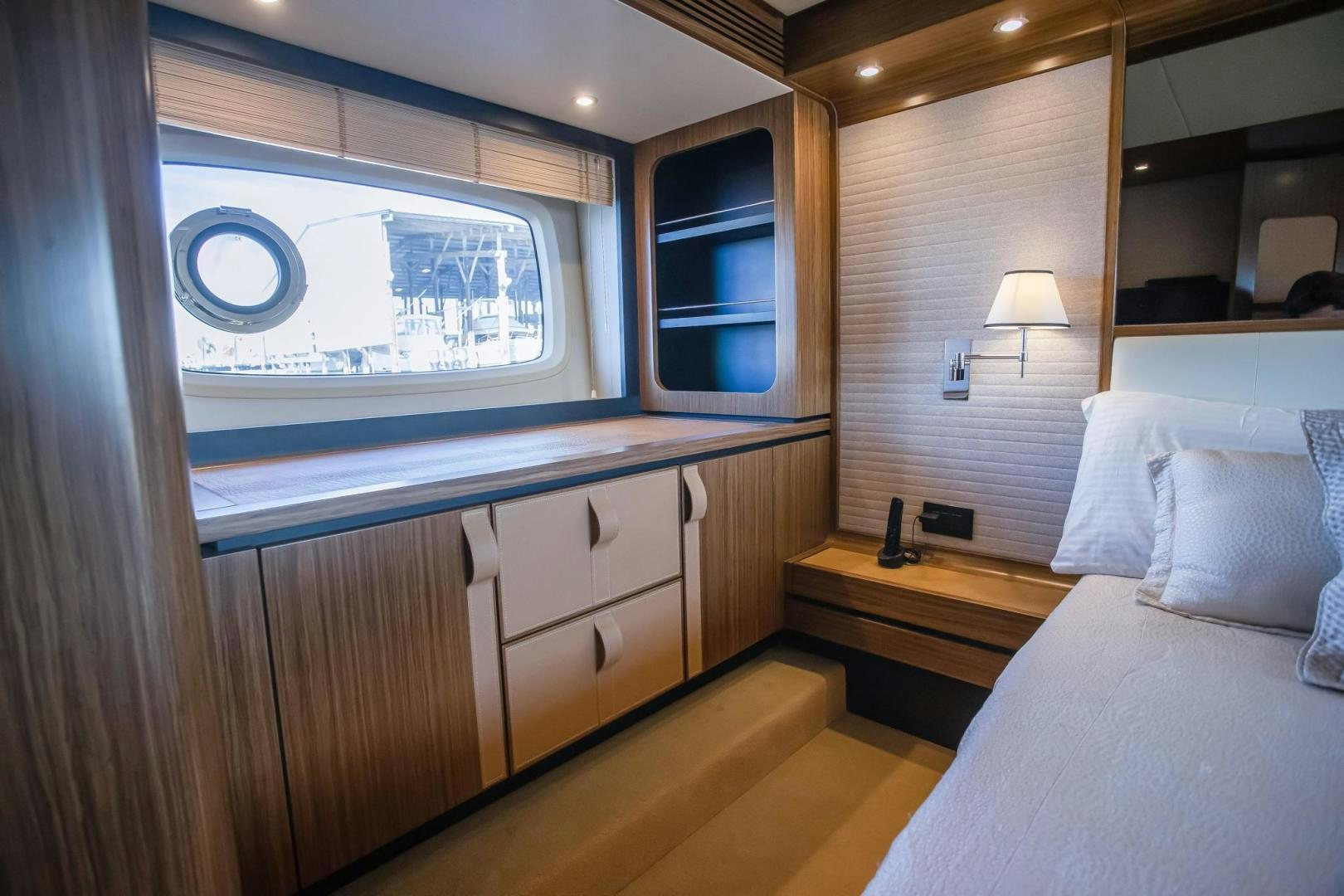 a room with a bed and a desk aboard ROY Yacht for Sale
