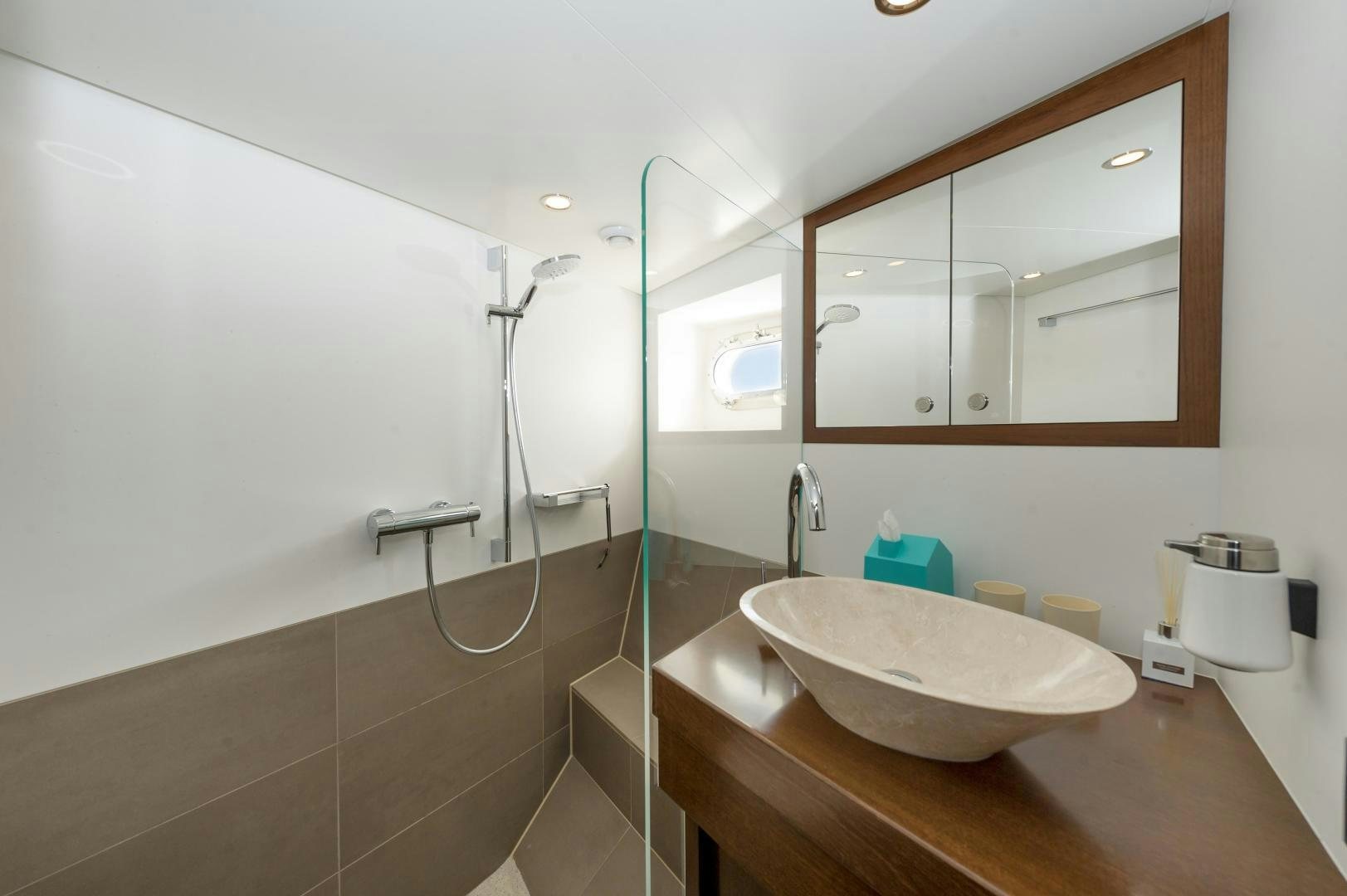 a bathroom with a sink and a mirror aboard MONARA Yacht for Sale