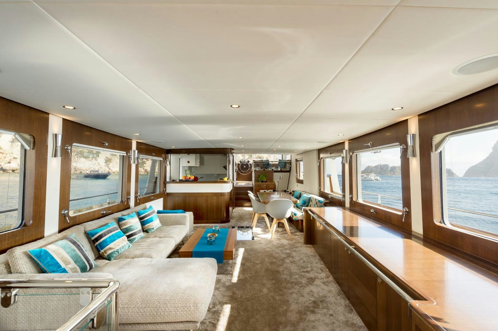 a living room with a couch and a table aboard MONARA Yacht for Sale