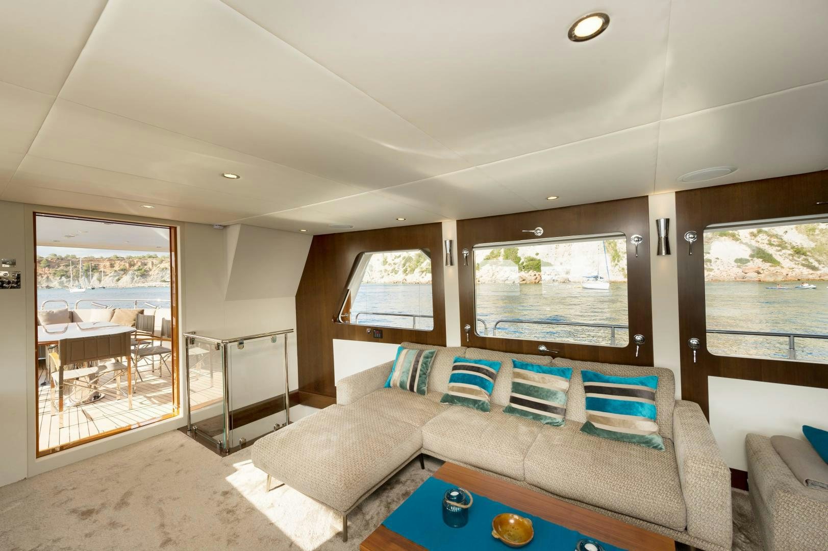 a living room with a couch and a table aboard MONARA Yacht for Sale