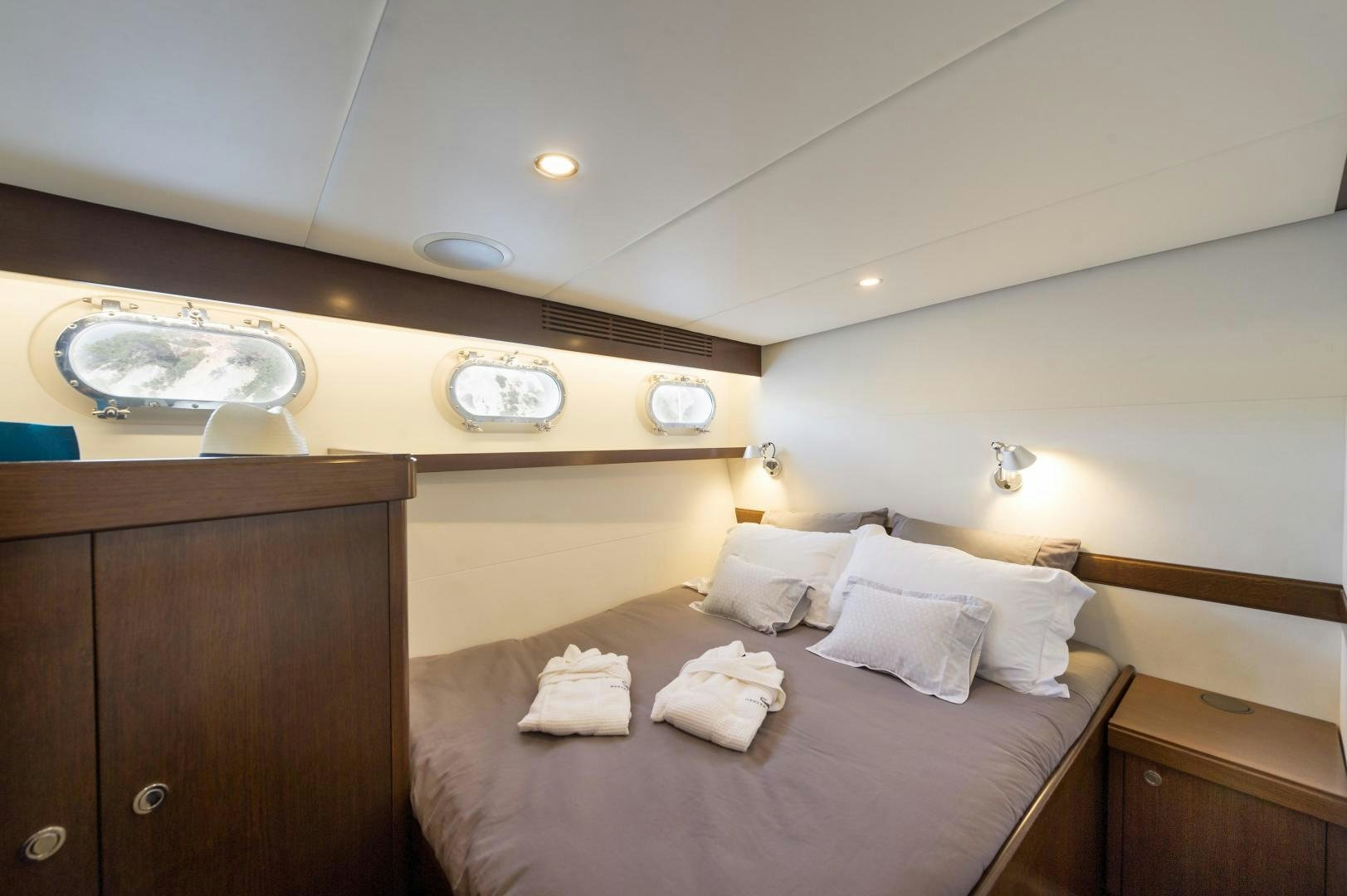 a bed in a room aboard MONARA Yacht for Sale