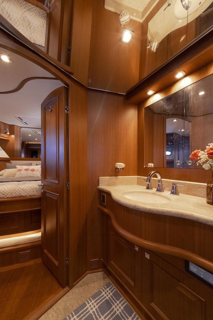 a bathroom with a sink and a mirror aboard PARADISE Yacht for Sale