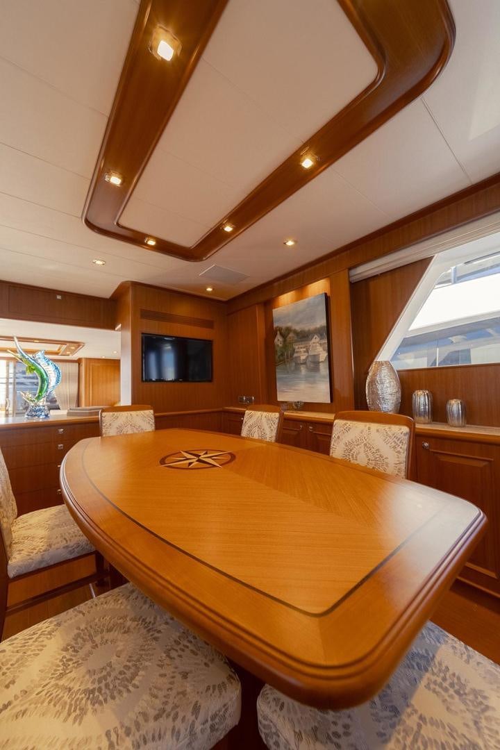 a dining table in a kitchen aboard PARADISE Yacht for Sale