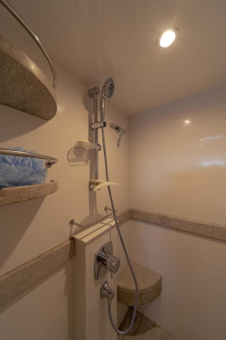 a shower with a sink and a mirror aboard PARADISE Yacht for Sale