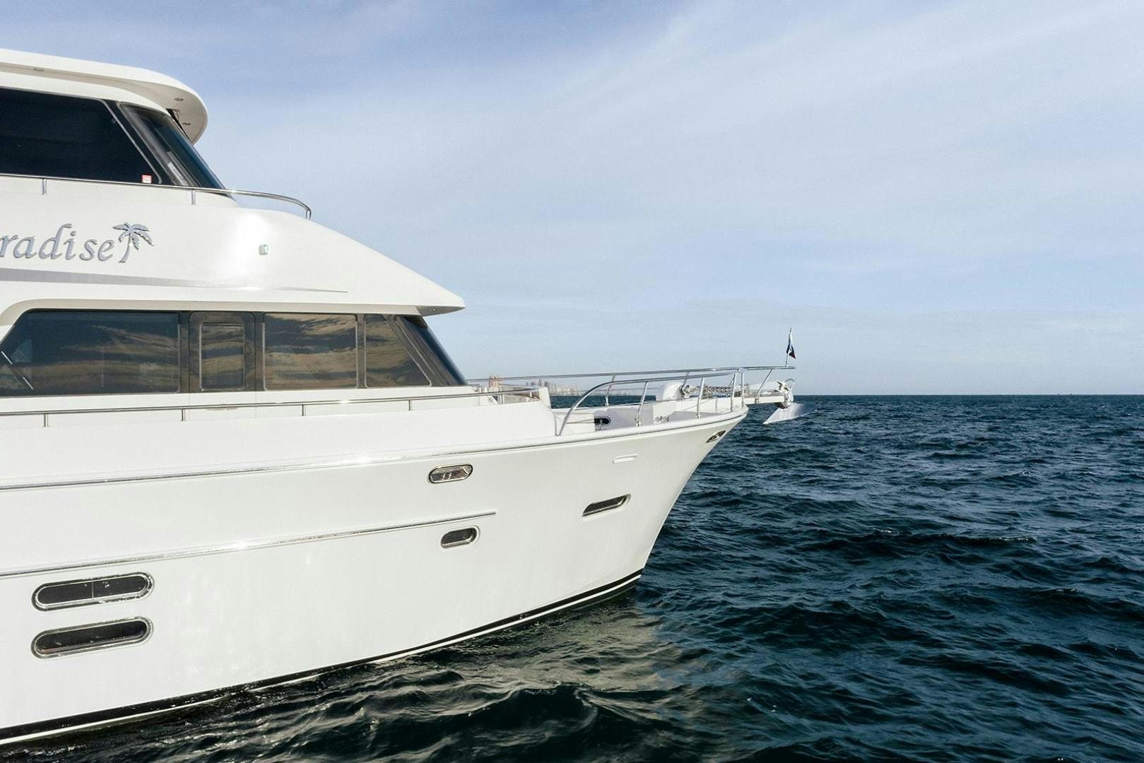 a white boat in the water aboard PARADISE Yacht for Sale