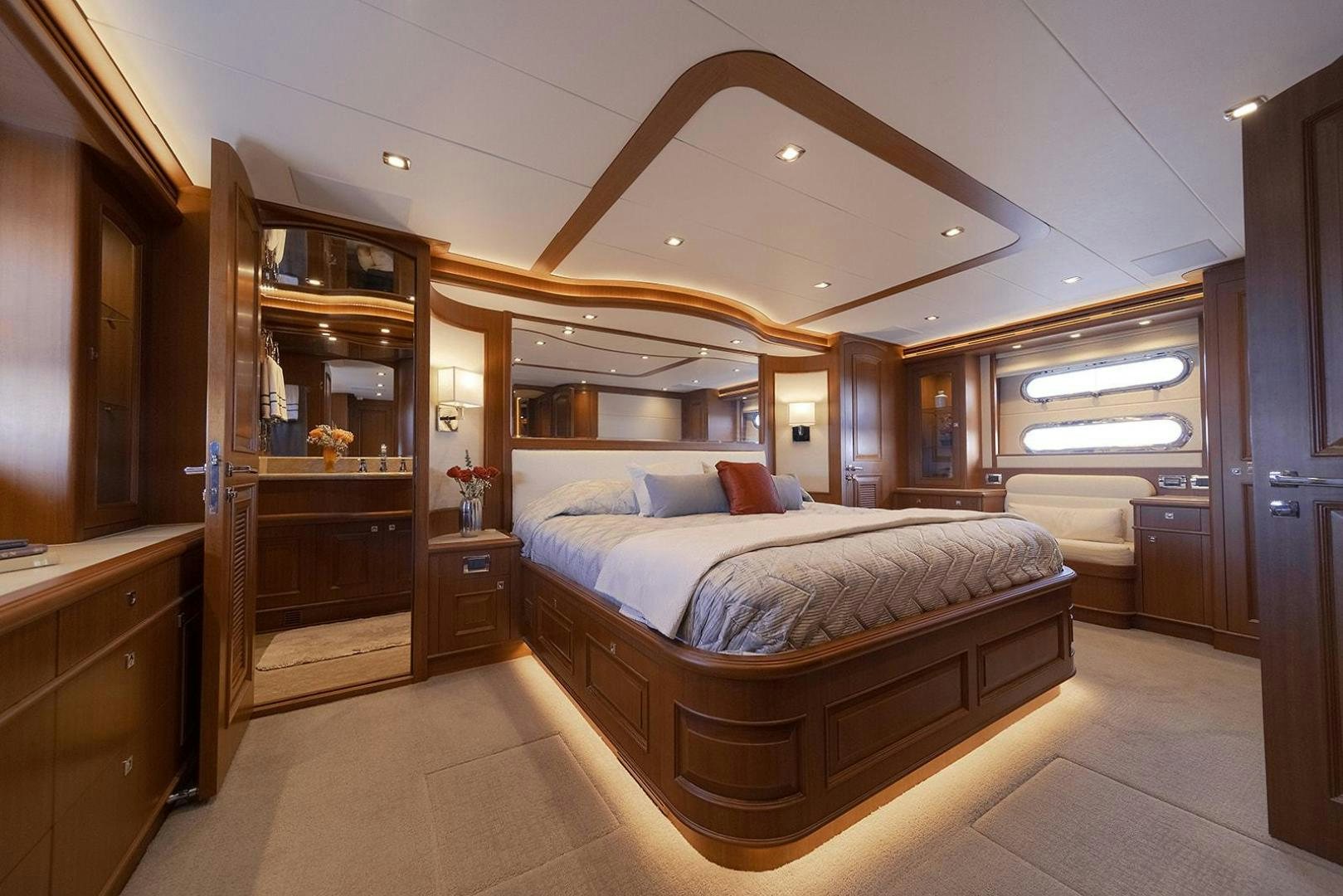 a large bedroom with a large bed aboard PARADISE Yacht for Sale