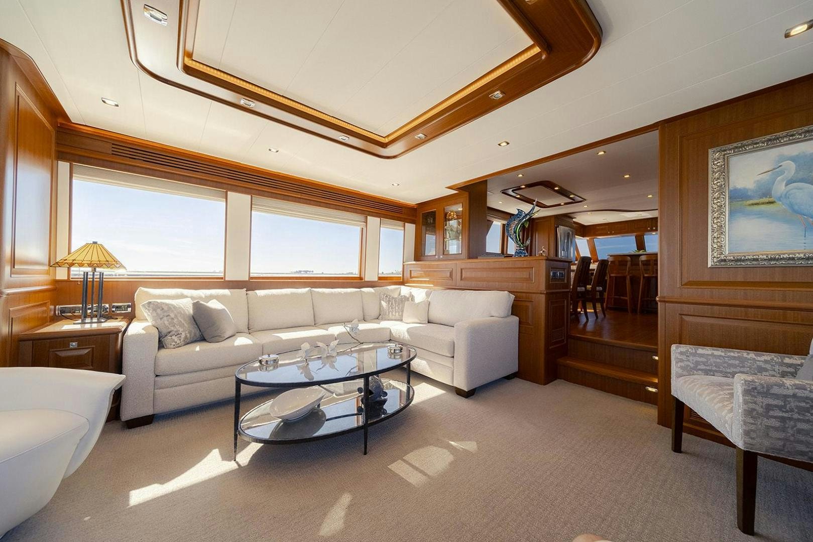 a living room with a large mirror aboard PARADISE Yacht for Sale