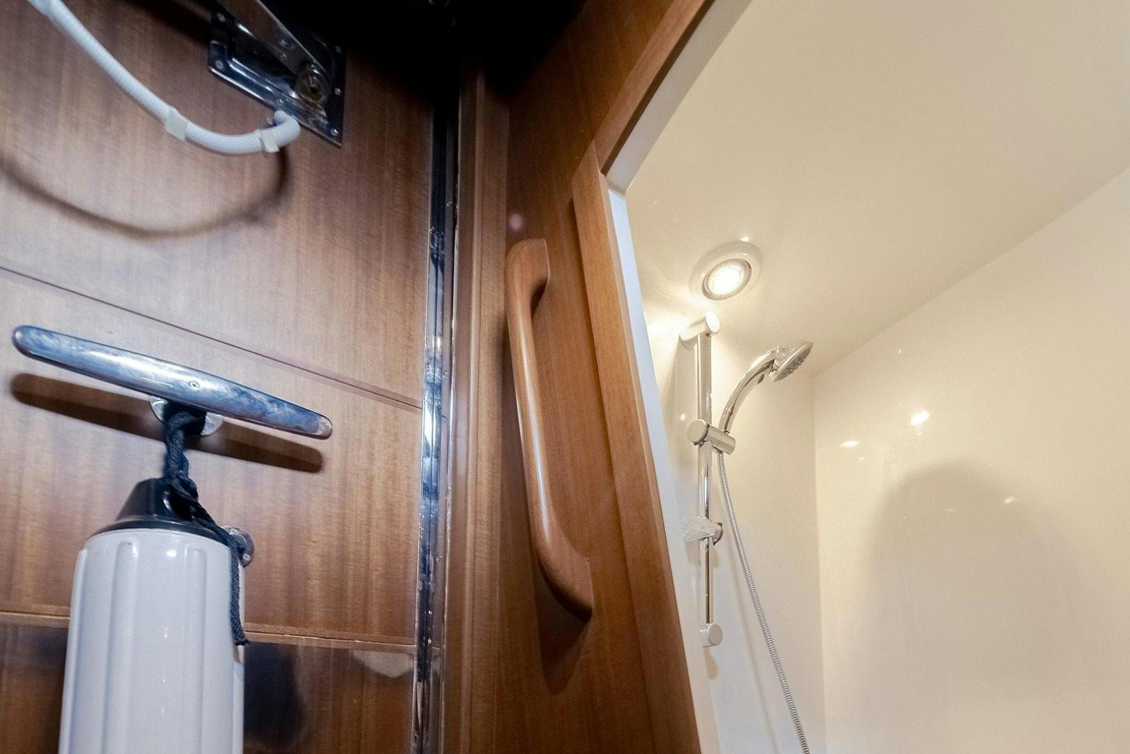 a shower with a metal handle aboard PARADISE Yacht for Sale