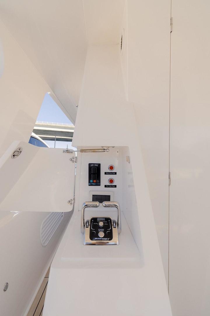 a white wall with a window and a computer on it aboard PARADISE Yacht for Sale