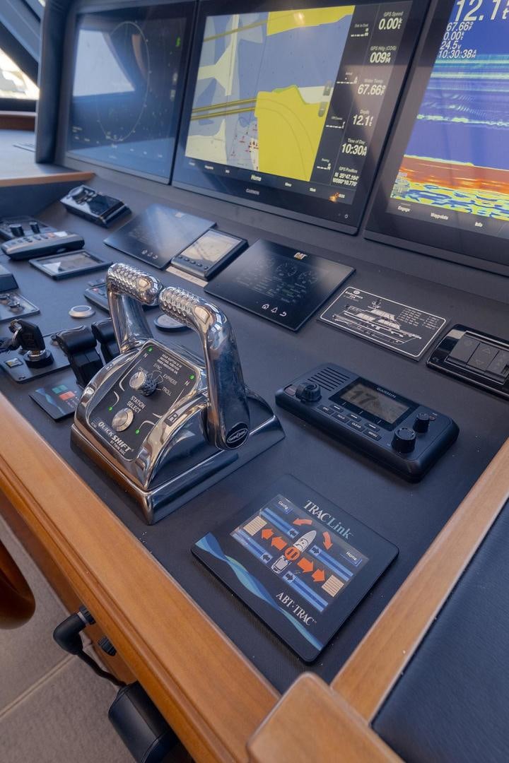 a computer desk with a couple of electronic devices on it aboard PARADISE Yacht for Sale