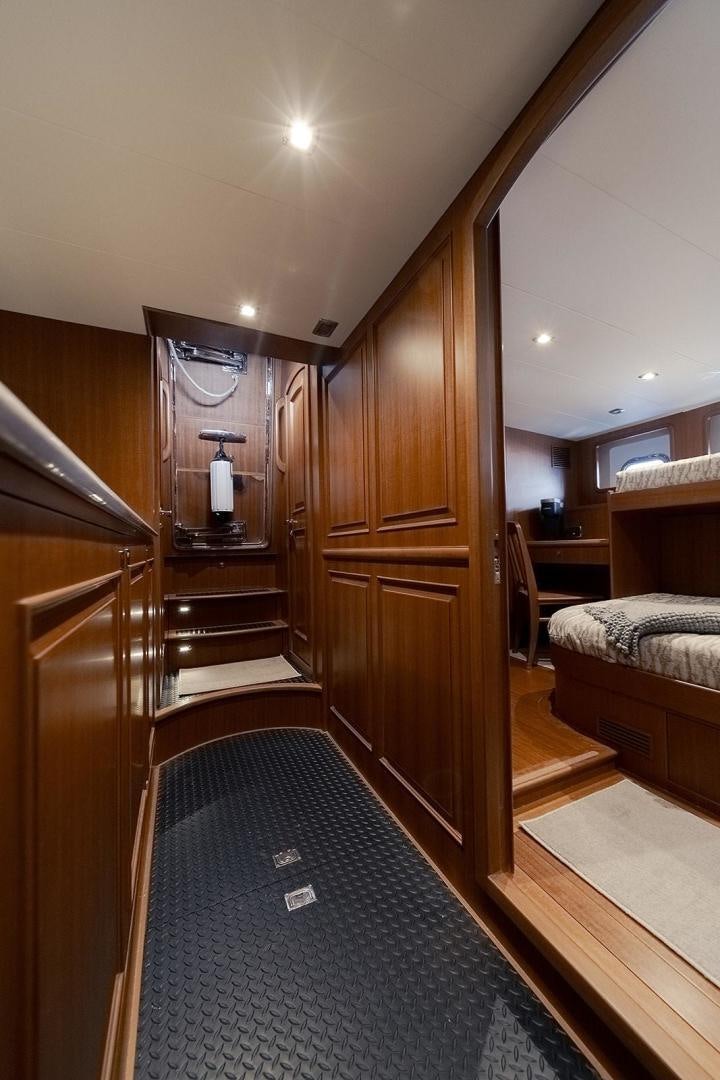 a wood door leading to a room aboard PARADISE Yacht for Sale