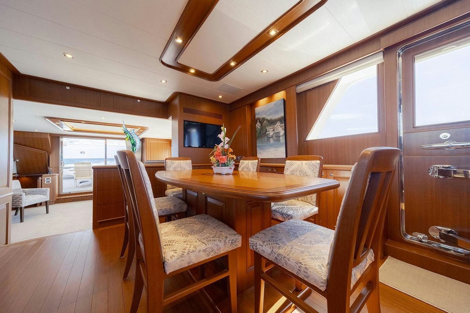 a dining room with a table aboard PARADISE Yacht for Sale
