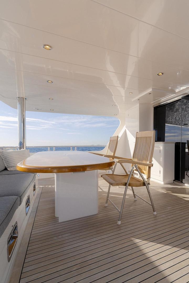 a room with a table and chairs aboard PARADISE Yacht for Sale