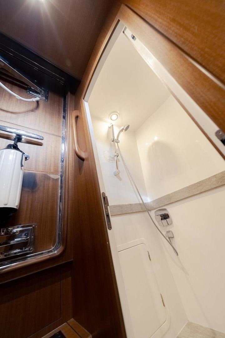 a bathroom with a mirror and a sink aboard PARADISE Yacht for Sale