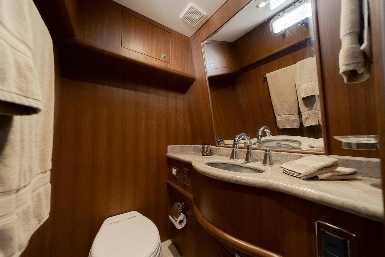 a bathroom with a sink and toilet aboard PARADISE Yacht for Sale