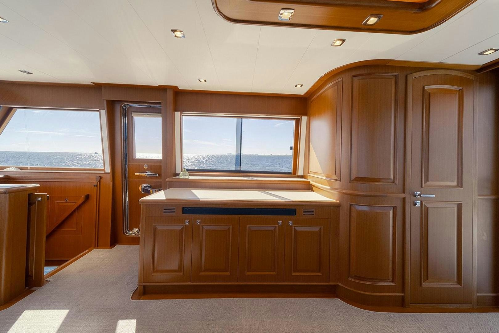a room with wooden cabinets aboard PARADISE Yacht for Sale