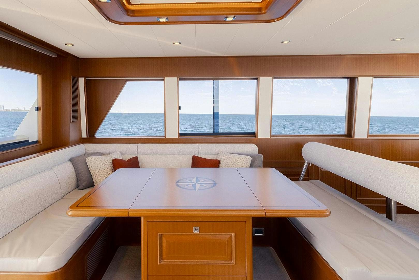 a room with a table and chairs aboard PARADISE Yacht for Sale