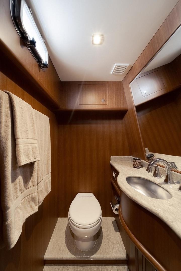 a bathroom with a toilet and sink aboard PARADISE Yacht for Sale