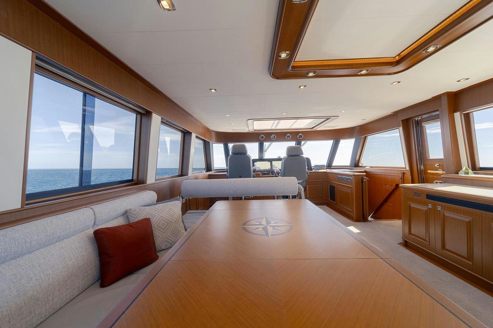 a large room with a couch and a table aboard PARADISE Yacht for Sale