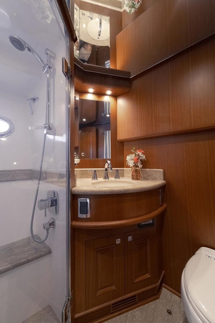 a bathroom with a sink and a shower aboard PARADISE Yacht for Sale