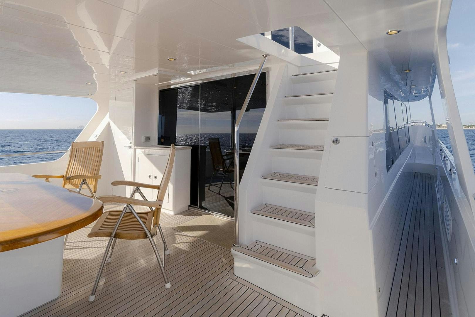 a white staircase leading to a beach aboard PARADISE Yacht for Sale