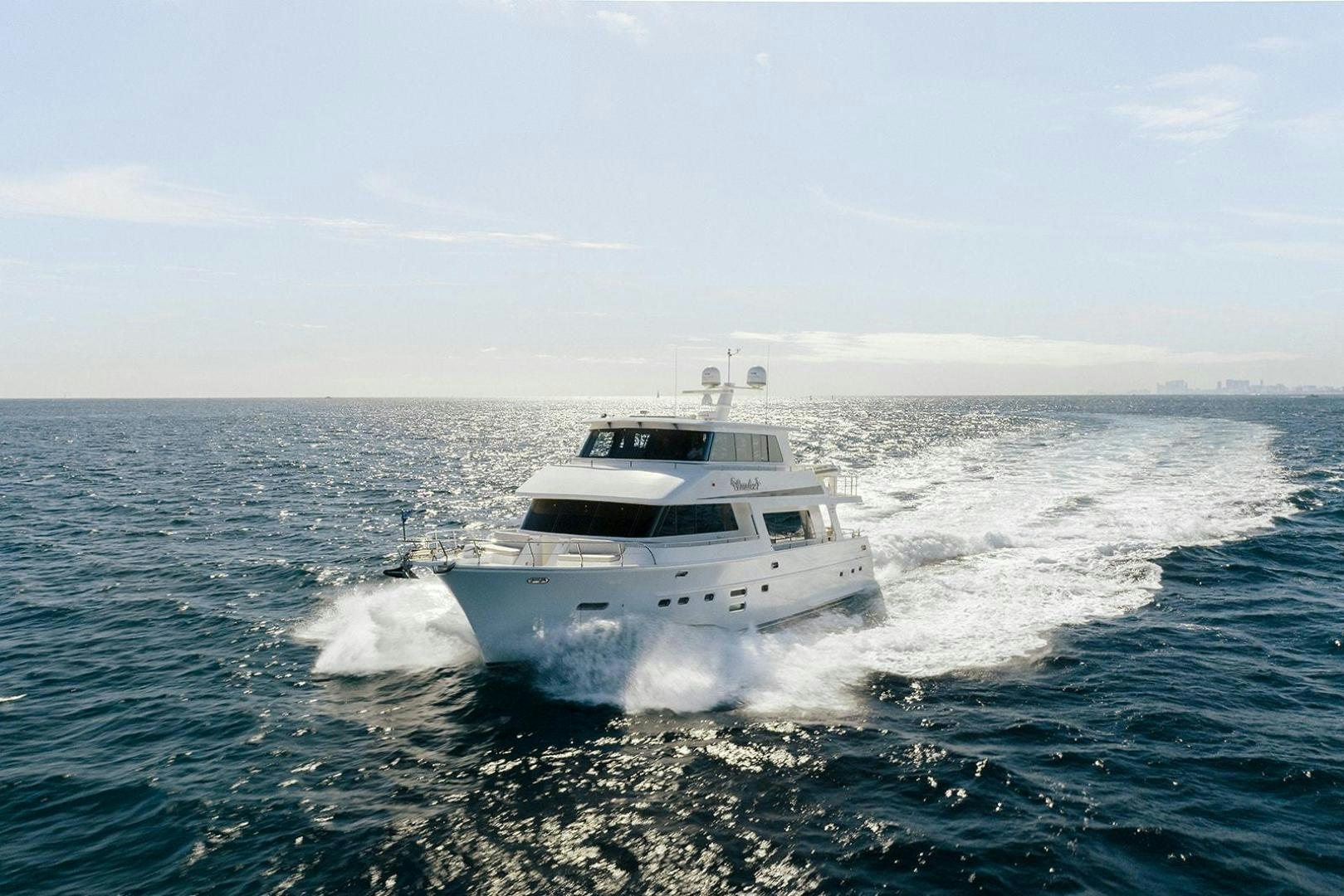 a white boat on the water aboard PARADISE Yacht for Sale