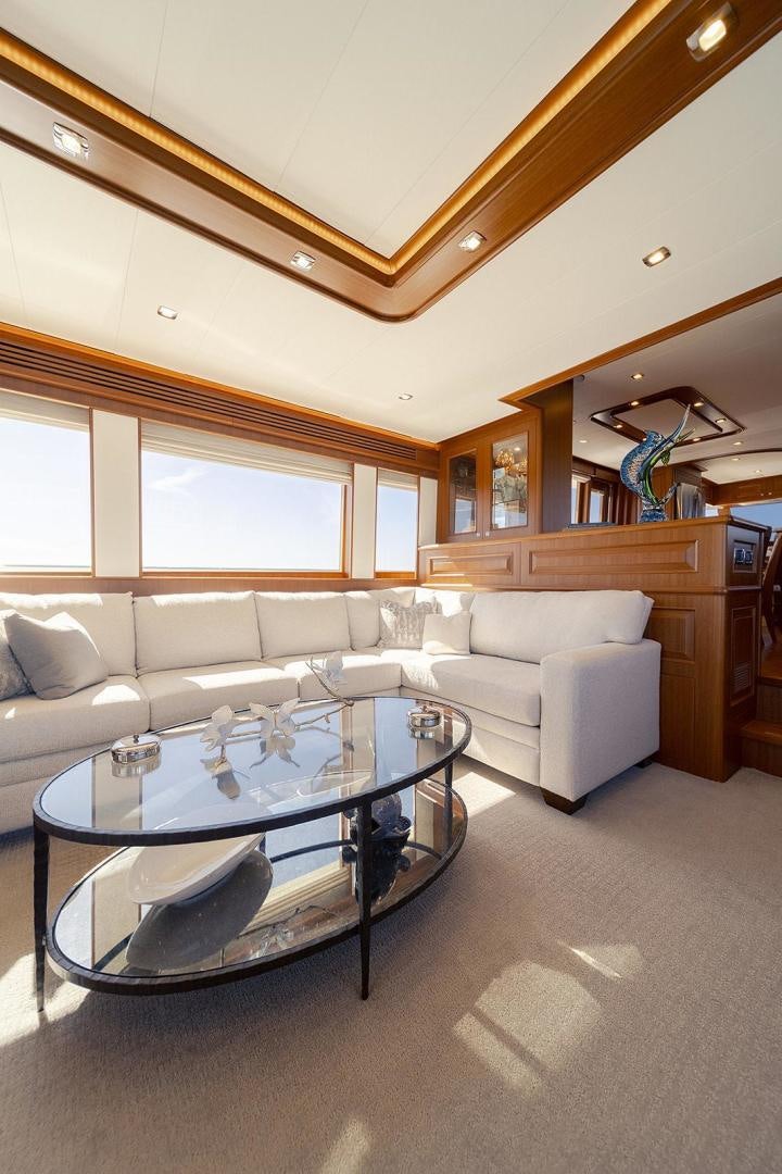 a living room with a large coffee table aboard PARADISE Yacht for Sale